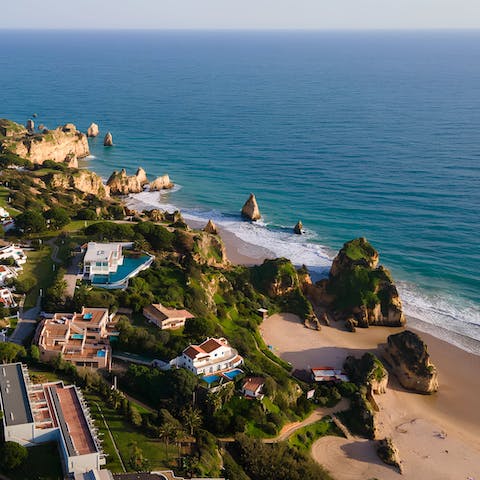 Take the five-minute stroll down to Praia dos Três Irmãos