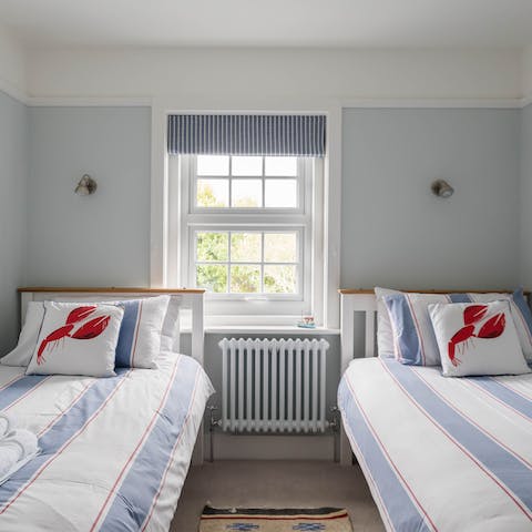 Cosy up in the coastal-themed bedrooms – your cul-de-sac setting ensures a quiet night