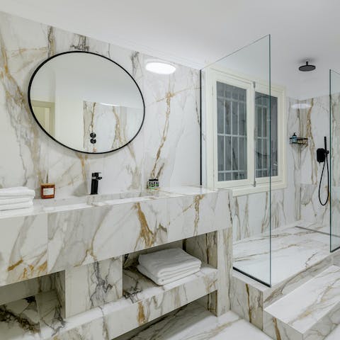 Get ready in the marble-clad bathroom for an evening out in Athens