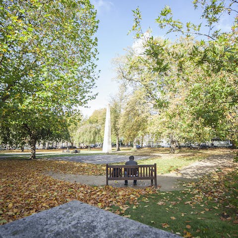 Enjoy a quiet moment in Queen's Square, just across the road