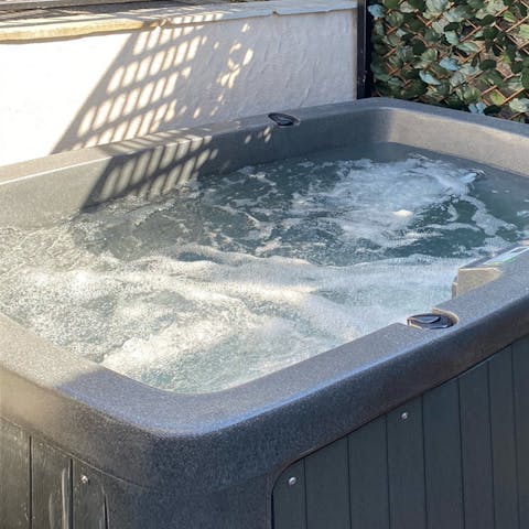 Enjoy a soak in your private hot tub as you unwind for the day