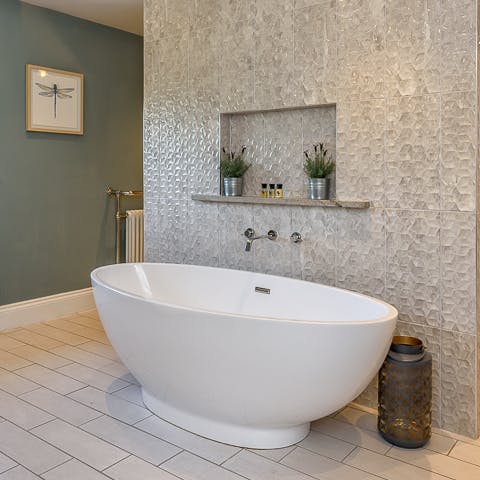 Enjoy a leisurely soak in the elegant bath tub