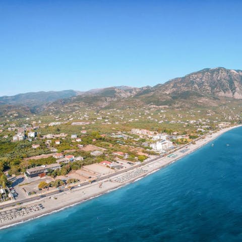Spend the day on the sands of Paralia Kalamatas, a short drive away