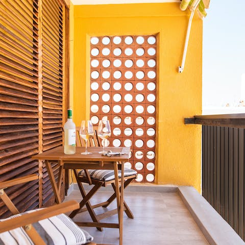 Relax with a cool drink out on your private balcony 