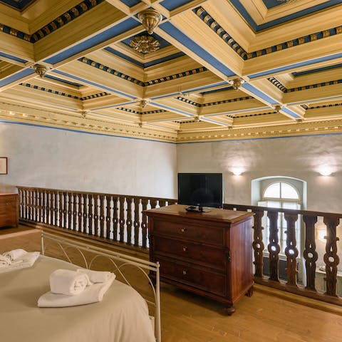 Embrace your historic location, gazing up at the coffered ceiling