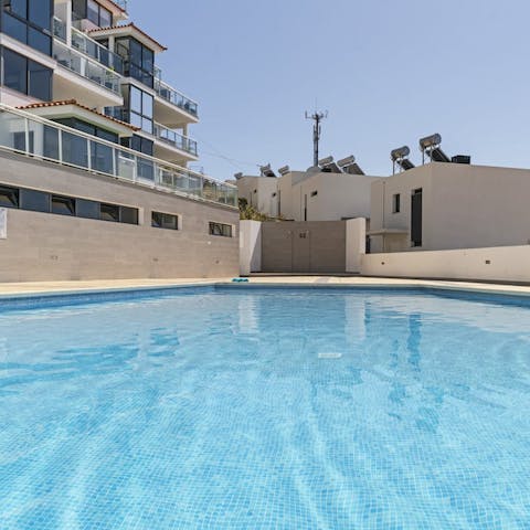 Do some morning laps of the building's outdoor pool