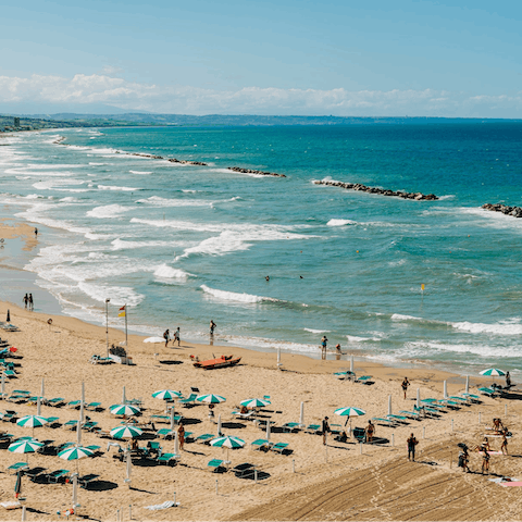 Spend the day on Quarto di Monte Beach, under a twenty-minute drive from this home