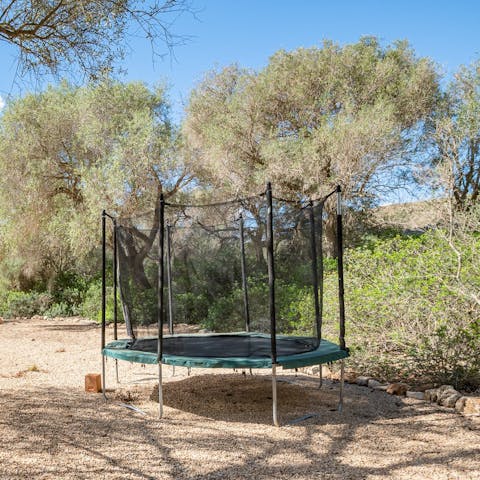 Bounce around with the kids on the trampoline