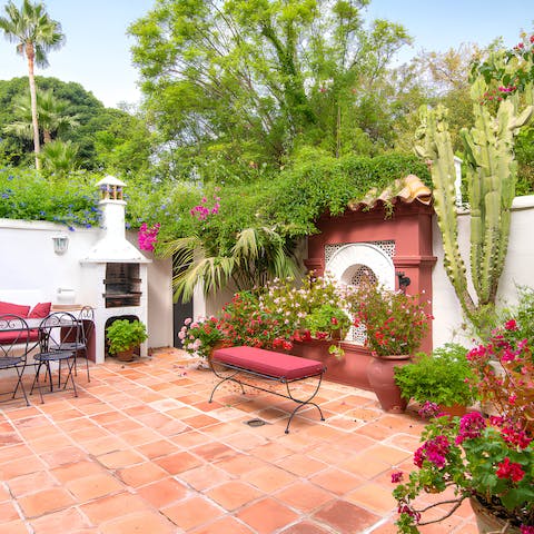 Relax on the flower-filled private patio
