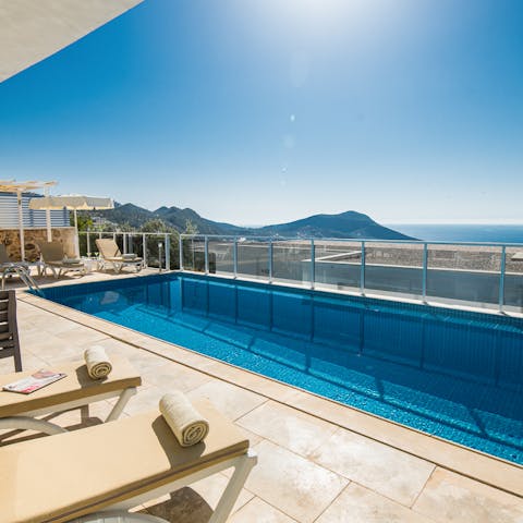 Lounge by the pool and gaze out at the Taurus Mountains