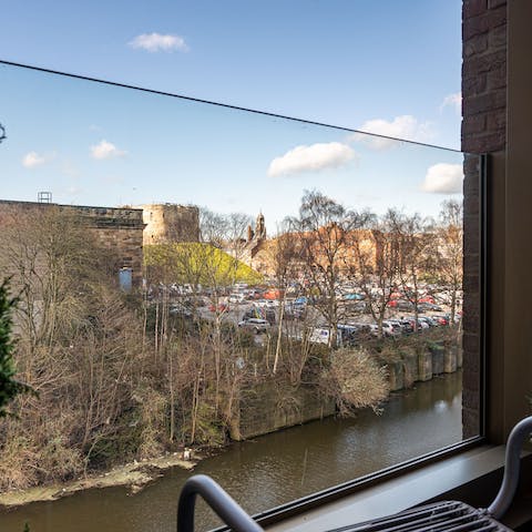 Admire the river and tower view from the balcony