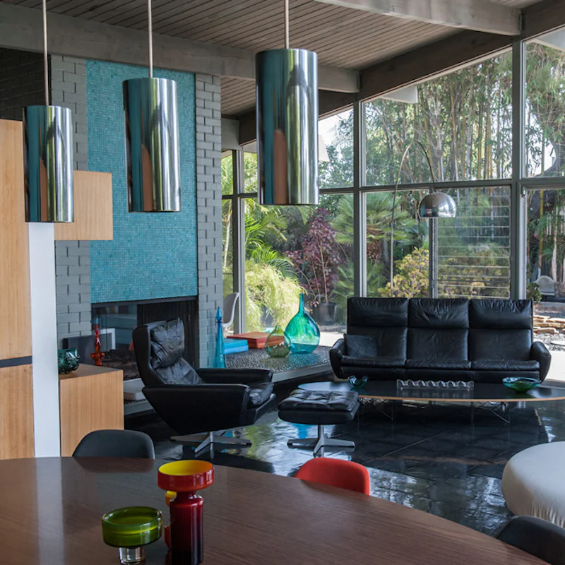 Admire the striking mid-century decor and window walls