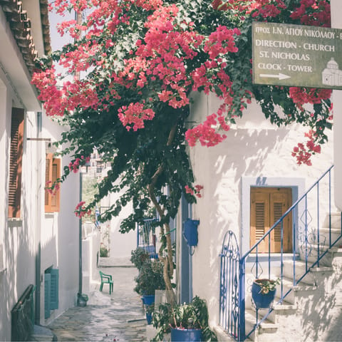 Roam Skiathos Town's cobbled lanes lined with cafes, boutiques and restaurants – it's a five-minute drive