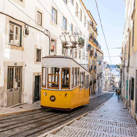Take a break from climbing Lisbon's hills and hop on the Bica Funicular  