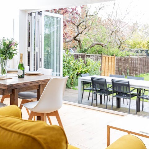 Open the bi-folding doors and eat at the table in the large private garden