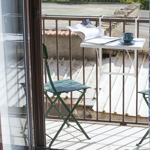 Enjoy a double espresso on the private balcony before starting your day