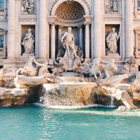 Make a wish by the Trevi Fountain, a two-minute walk away