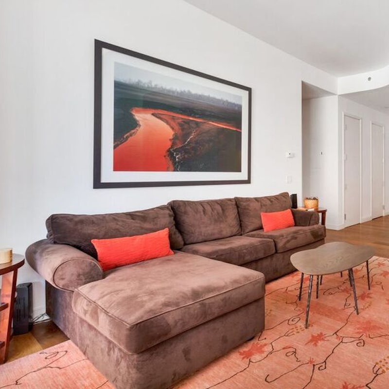 Kick back and relax on the plush sofa after a busy day exploring NYC