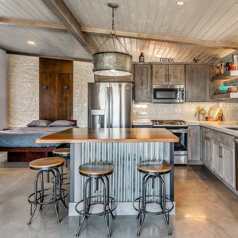 Rustle up a delicious feast in the modern kitchen – we love the concrete countertops and big island