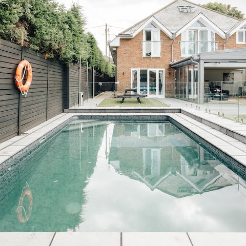 Enjoy an early morning swim  in the home's private outdoor pool