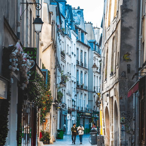 Stroll three minutes into Le Marais for colourful, cobbled lanes