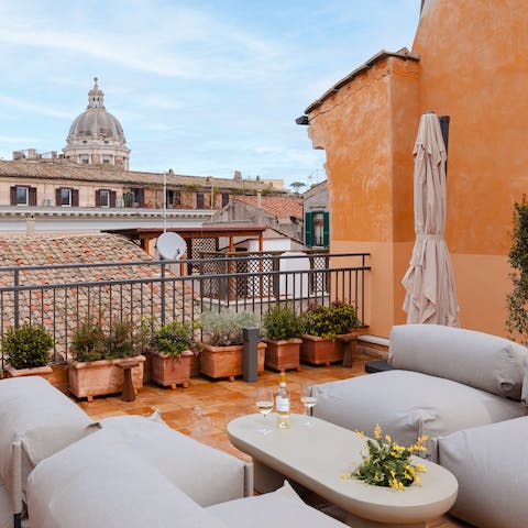 Pour a glass of your favourite wine and chill out on the communal roof terrace