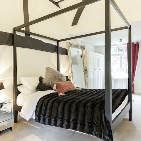 Sleep like royalty in the four-poster master bed
