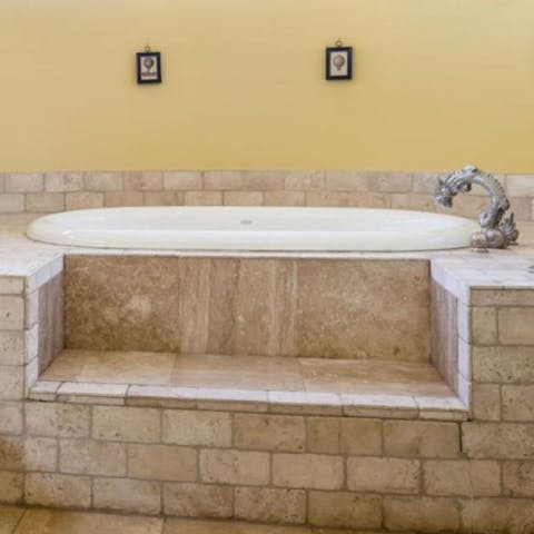 Take a relaxing soak in the Jacuzzi bathtub