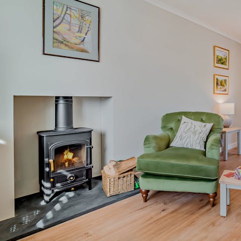Take a seat by the wood burner and get cosy