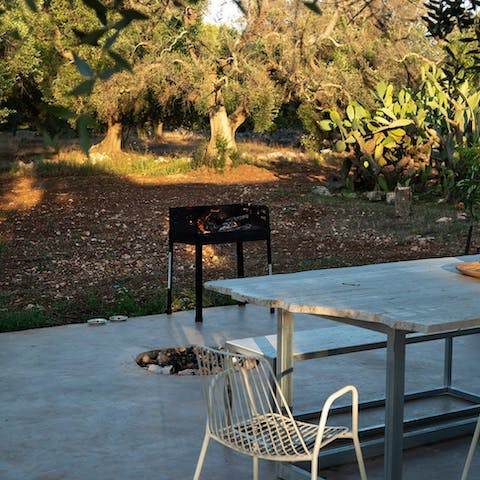 Dine alfresco by the olive grove and listen to the chirp of crickets