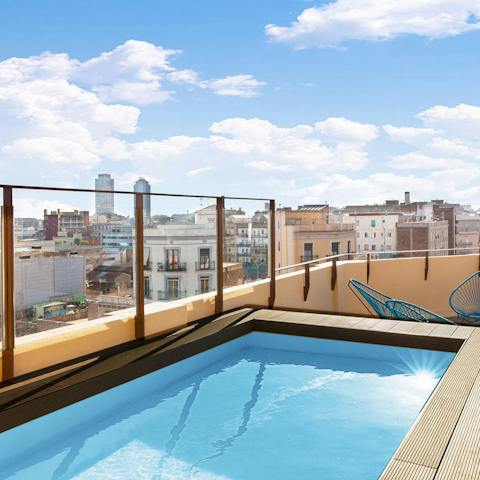 Watch over the city from the communal pool—it's extra special at sunset