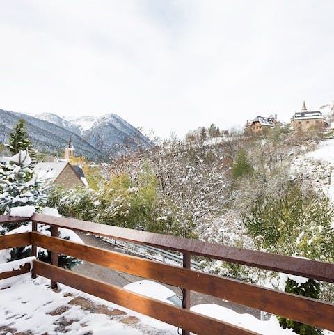 Admire the gorgeous mountain views over a glass of wine on your private balcony