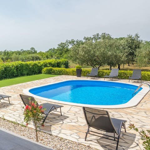 Soak up the sun on the loungers before cooling off in the pool