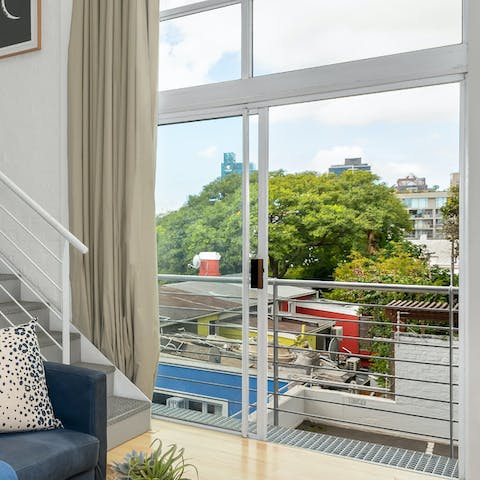 Stand by the open patio door and take in the city views with a morning coffee