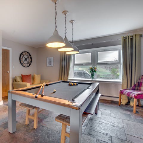 Get competitive with a game of snooker by the wood burning stove