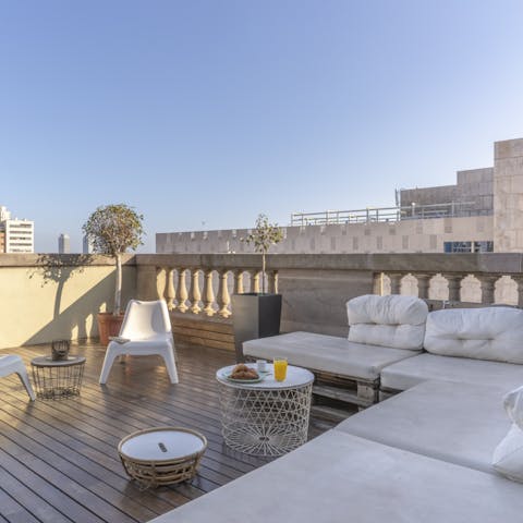 Have some cava on the stylish terrace at sunset