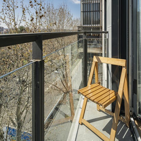 Sip your morning coffee on the petite balcony and plan your day