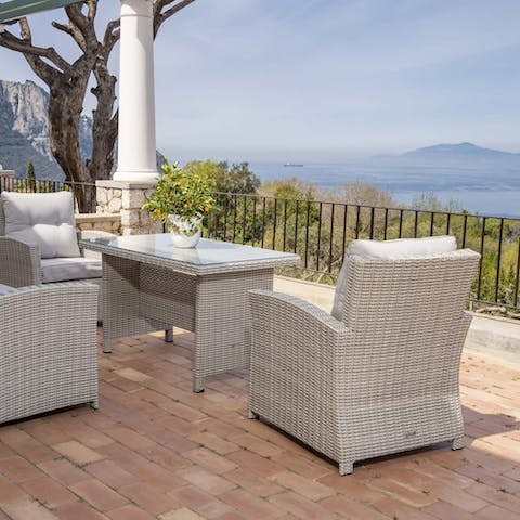 Unwind on the terrace with a glass of wine, admiring the Gulf of Naples