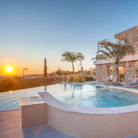 Enjoy the serene sunset from the luxury of the hot tub