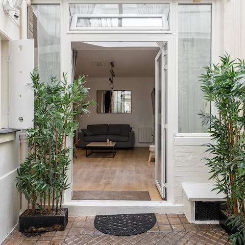 Relax in your quiet ground floor apartment, accessed via a rear courtyard