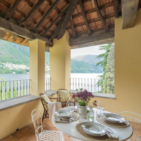 Enjoy an alfresco meal with views across the lake