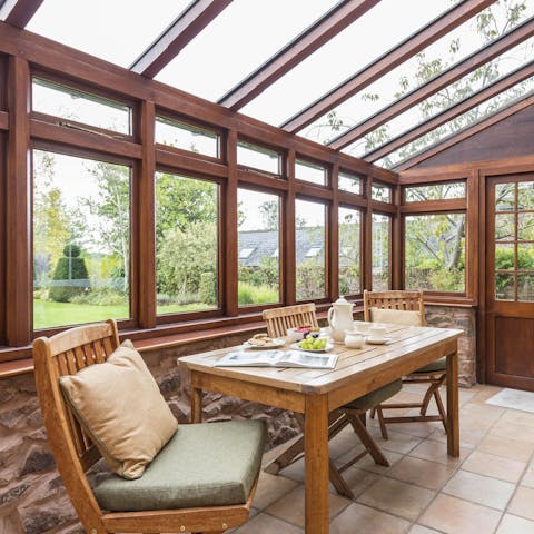 Enjoy breakfast in the conservatory, overlooking the gardens