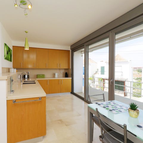 Try your hand at cooking some local cuisine in this well-lit kitchen with your family