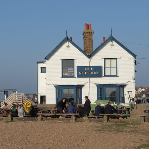Sip a pint overlooking the sea at Old Neptune, just over 100 yards away