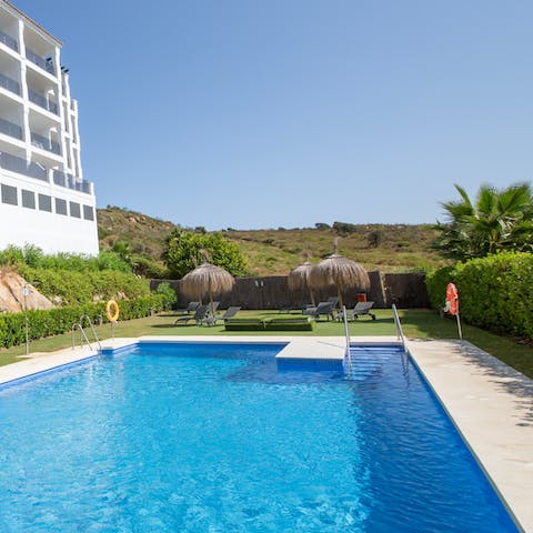 Cool off from the Spanish sun with a dip in the shared outdoor pool