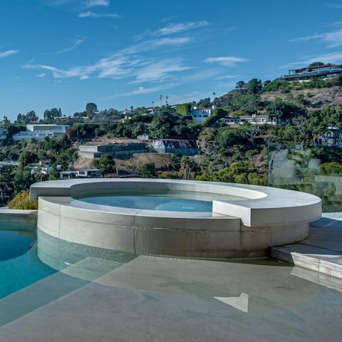 Unwind in the elevated jacuzzi, offering a prime location to take in the views
