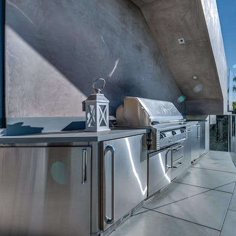 Fire up the barbecue at the outdoor kitchen area for a feast to remember