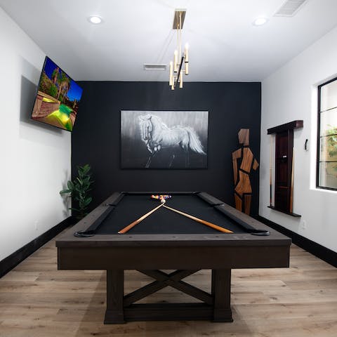 Get competitive at the billiards table in the recreation room