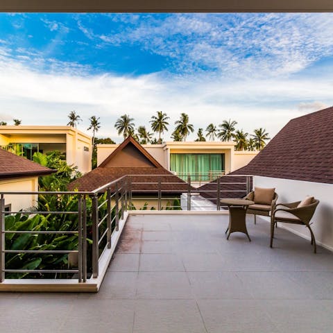 Watch the distant palm trees swaying from the master bedroom's private terrace