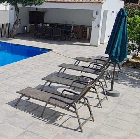 Soak up the Spanish sunshine on the poolside loungers